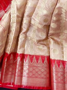 Gorgeous Semi Banarasi Silk Saree in Beige and Red Color combination. The Saree is dyeable. Item : SareeColor : Beige and Red Base Fabric : Semi Banarasi Silk Blouse piece : YesBlouse material : Banarasi Georgette Silk Work : Handloom with Zari weavingFall & Edging(Pico) Yes/No : YesDisclaimer -:- Color variation is possible due to various reasons like phone or desktop setting, resolution etc. Please don't hold us responsible. Our aim is to put the exact color of the Saree.- If the Saree is Pure Red Color Combinations, Silk Saree Banarasi, Blouse Material, Readymade Blouse, Soft Silk Sarees, Banarasi Sarees, Party Wear Sarees, Blouse Piece, Silk Blouse