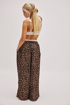 So luxe in every way, these wide-leg lounge pants from Intimately are featured in a high-rise style and silky fabrication with a fun print for an extra playful touch. **Fit:** High-rise, relaxed, wide-leg **Features:** Silky fabrication, adjustable drawstring waistband, side pockets, seamed details **Why We | Sweet Intentions Wide-Leg Pants by Intimately at Free People in Brown, Size: L Wide Leg Sleepwear For Lounging, Loosely Fitted Wide Leg Pants For Summer Lounging, Chic Wide Leg Lounging Pants With Elastic Waistband, Chic Wide Leg Pants With Elastic Waistband For Lounging, Wide Leg Sleepwear For Vacation In Spring, Wide Leg Sleepwear For Spring Vacation, Wide Leg Spring Vacation Sleepwear, Wide Leg Sleepwear With Elastic Waistband, Wide Leg Bottoms With Elastic Waistband For Pajama Party