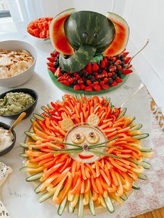 an assortment of fruits and vegetables arranged in the shape of a face