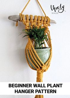 The image contains a plant hanger made with mustard-colored rope mounted onto a piece of driftwood. The rope has been knotted to form a small pouch for a plant and pot. The text on the bottom of the image reads "Beginner Wall Plant Hanger Pattern". Gathering Knot, Double Half Hitch Knot, Macrame Wall Plant Hanger, Plant Hanger Pattern, Clove Hitch Knot, Beginner Macrame, Hitch Knot, Driftwood Macrame