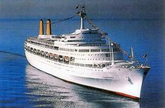 a large white cruise ship in the ocean