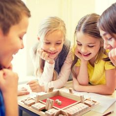 three children playing a board game together