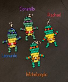 four beaded keychains with different colors and shapes