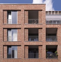 an apartment building with balconies and windows