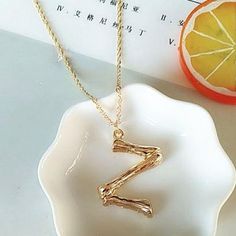 Go bold with your initial with this gold charm necklace. It's great to add as a layered piece with your other gold necklaces. Also makes a great gift. Gender: WomenNecklace Type: Pendant NecklacesChain Type: Link ChainMaterial: MetalShape\pattern: LetterPendant Size: 4*2.8cm | 1.57 inches x 0.78 inchMetals Type: AlloyChain length: 49cm | 19.30 inches (adjustable) Shipping Times: 12-20 days to the U.S.,13-26 days to Australia, 16-26 days to Canada, 16-30 days to the U.K. Denmark: 14-23 days; Trac Trendy Gold Initial Necklace With Clavicle Chain, Gold Trendy Initial Necklace, Trendy Gold Initial Necklace, Trendy Gold Necklace With Initial Pendant, Trendy Personalized Gold Necklaces, Gold Pendant Initial Necklace, Trendy Gold Plated Initial Pendant Necklace, Trendy Gold Pendant Initial Necklace, Trendy Gold Initial Pendant Necklace