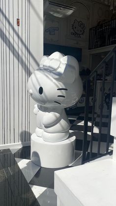 there is a hello kitty statue on display outside