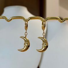 🌙Gold plated Crescent moon hoop earrings, Crescent moon huggies, Crescent moon dangle earrings Crescent moon dangle earrings are a popular style of earrings that feature a design resembling the shape of a crescent moon🌙 they gently sway and catch the light as you move, making them eye-catching and charming earrings🌝💛 * Hypoallergenic jewelry  * Hoop size: 11mm * Charm size: 13mmx11mm * Gold plated brass It comes with gift wrapped🎁 Free tracked shipping in the UK🚛 Shipped same or next business day🤍 Message me anytime for any questions💙   All earrings can also be made into necklaces.            Please message me separately ❤️ Follow us on Instagram: blueminglondon ❤️ Cheap Crescent Moon Charm Jewelry, Trendy Moon Charm Drop Earrings, Moon Charm Hoop Earrings In Celestial Style, Moon Charm Huggie Earrings, Metal Moon-shaped Hoop Earrings, Gold Half Moon Hoop Earrings With Moon Charm, Trendy Crescent Earrings As Gift, Trendy Crescent Earrings For Gift, Celestial Huggie Earrings With Moon Charm