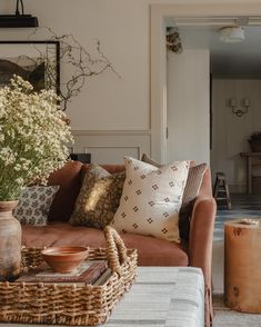 a living room filled with furniture and flowers