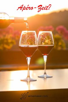 two wine glasses filled with red wine being poured into each other and the words it's national drink wine day plan a vina date to celebrate