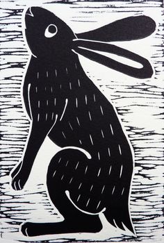 a black and white drawing of a rabbit