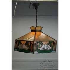 a stained glass lamp hanging from the ceiling