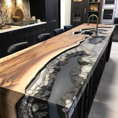 a kitchen counter with an unusual design on it's top and the island is made out of wood