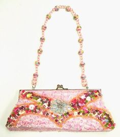 This cool purse is fully sequin beaded front & back tip to tip. Perfect for pairing up with your costume or to carry with you in event! Pink Embellished Evening Bag, Handheld Sequined Evening Bag For Parties, Embellished Clutch For Summer Evenings, Embellished Clutch Evening Bag For Party, Embellished Party Clutch Evening Bag, Handheld Sequined Evening Bag, Pink Rectangular Evening Bag For Night Out, Pink Sequin Evening Bag, Embellished Pink Evening Bags