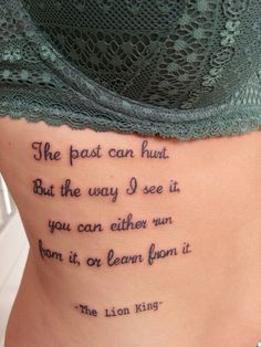 the back of a woman's stomach with a poem written on her lower side