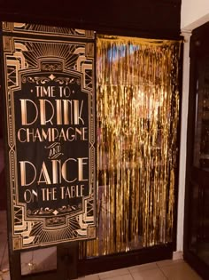 a sign that says time to drink champagne and dance on the table in front of a door