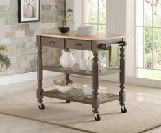 a kitchen island with two drawers on wheels