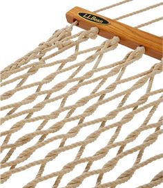 a rope hammock with a wooden handle