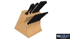 a wooden block with black knives sticking out of it's sides on a white background