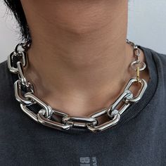 This Mixed Large Link Chain Necklace from Maison Soyenne is crafted with eco-friendly and sustainable aluminum, offering a lightweight and hypoallergenic piece of jewelry with a modern, hip-cool edge. Fastened with a secure and easy-to-wear sailor clasp, this statement necklace is on-trend and perfect for any modern wardrobe. Length: 22" Thickness: Big paperclip-25mm / Figaro Chain-15mm / Small Paperclip-7mm Sailor Clasp Diameter: 19mm Thoughtfully handcrafted at Maison Soyenne's studio, Los Ang Chain Collar Necklace, Large Chain Necklace, Chain Necklace Drawing, Mixed Metal Jewelry Layering, Cold Jewelry, Big Chain Necklace, 3 Chain Necklace, Chain Aesthetic, Afro Jewelry