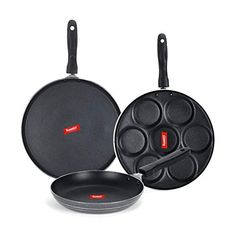 two pans and one frying pan are shown