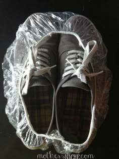 a pair of shoes sitting on top of a plastic bag