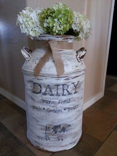 an old pail with some flowers in it