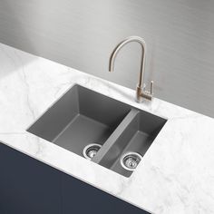 a kitchen sink with two faucets on the side and marble countertop top