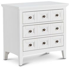 a white dresser with six drawers and two doors