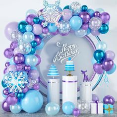 a birthday party with balloons, presents and decorations