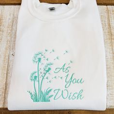 Embroidered As You Wish Dandelions  Sweatshirt or T-Shirt  1st Photo is a white crewneck sweatshirt with mint thread  Adult T-Shirts and Sweatshirts  Small Medium Large XL 2XL 3XL Green Crew Neck Sweatshirt With Machine Embroidery, Green Crew Neck Sweatshirt With Embroidery, White Crew Neck Tops With Machine Embroidery, White Custom Embroidered Sweatshirt, White Crewneck Sweatshirt, White Crewneck, Embroidered Sweatshirts, Dandelion, Crew Neck Sweatshirt