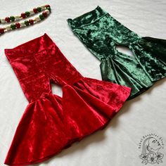 The cutest bells for your festive little babe! These are legging style pants with a high waisted, fold-over yoga waistband. Made from soft, crushed velvet, in either green or red. * If you are in between sizes, I suggest sizing up. * Need a size not listed, or another variation of this print? Feel free to message me for custom orders! Fitted Pants For Christmas Party, Fitted Holiday Festive Pants, Fitted Pants For Holiday Festive Occasion, Fitted Pants For Holiday Festivities, Fitted Green Festive Bottoms, Fitted Holiday Bottoms, Fitted Green Bottoms For Festive Occasions, Festive Fitted Red Pants, Fitted Bottoms For Christmas Holiday