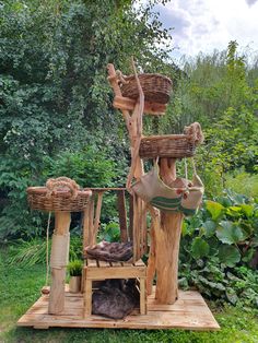 a wooden bench made out of logs with baskets on top and other items hanging from it