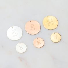 14k Gold Filled, Sterling Silver or 14k Rose Gold Filled Engraved ADD ON Initial. Customize jewelry from our shop with our engraved add on initial coin. Select which size coin along with the initial and add it to your cart along with the piece you would like to customize. This listing is for the initial coin only. Chain not included. NOTE: For any other word customization - please message us BEFORE placing your order …………………………………. Details: Pendant is 14k Gold Filled, Sterling Silver or Rose Gold Filled Disc measures 12mm About Your Jewelry If you are not wearing your jewelry it is best to store it in a cool, dry place. *Free shipping option is without a tracking number. Customize Jewelry, Chakra Necklace, Initial Necklace, Custom Jewelry, Or Rose, Gold Filled, Birthday Cards, Initials, Coin