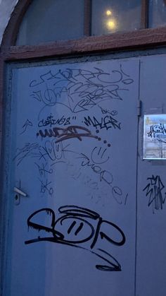 a door with some graffiti on it