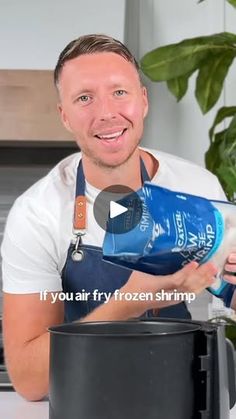 a man pouring water into a pot with the words if you air fry frozen shrimp