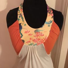 New But Never Worn,Hooks In Back At Neck,Unique Details Under Arm,Logo Stitched Near Hem,95% Modal,5% Spandex,Size Small But Runs A Lil Large Bin (D-31) Fitted Orange Cotton Tank Top, Casual Multicolor Halter Neck Tank Top, Sleeveless Patchwork Top For Vacation, Sleeveless Patchwork Vacation Tops, Orange Halter Neck Tank Top For Spring, Stretch Orange Tank Top For Summer, Fitted Color Block Tops For Beach, Beach Patchwork Tank Top, Orange Stretch Tank Top For Spring