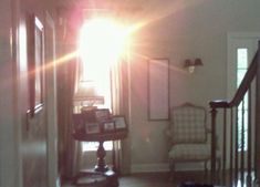 the sun shines brightly through an open door