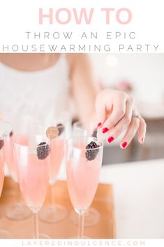 three glasses filled with pink liquid and topped with blackberries