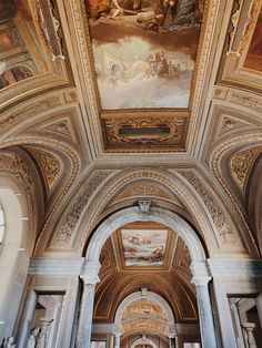 the interior of a building with paintings on the ceiling