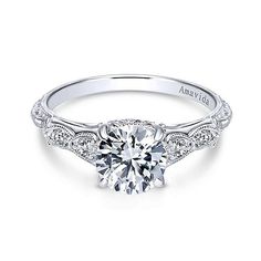 a white gold engagement ring with an intricate design on the shan shan shan shan shan shan shan