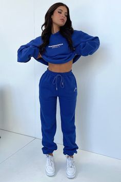 Blue Sweats With Elastic Waistband For Winter, Comfortable Blue Sweats With Ribbed Cuffs, Blue Winter Sweats With Elastic Waistband, Blue Sweats With Elastic Waistband For Leisure, Blue Sweats With Elastic Waistband, Blue Relaxed Fit Sweatpants For Winter, Blue Sweatpants With Elastic Waistband, Blue Fleece Bottoms For Winter, Trendy Fleece Sweats With Elastic Waistband