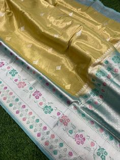 This is a very beautiful Pure banarasi katan tissue silk handloom saree Kadhyal weave border, Sona Rupa weave booties, golden n silver zari, paithani tilffi border, with  blouse piece.  Saree length - 5.5 mtr. Blouse - 1 mtr.  Dry clean only . Please note - color may be vary a little due to sunlight and photography . Please message us after purchasing in case you want fall and Pico done it not . No extra charges for fall and Pico but inform us . Blouse stitching is also available . Yellow Banarasi Silk Traditional Wear With Border Detail, Yellow Katan Silk Dupatta With Border, Yellow Tussar Silk Dupatta With Border, Yellow Katan Silk Saree With Border, Traditional Zari Weaving Dupatta, Zari-weaved Saree Traditional Wear For Gift, Yellow Banarasi Silk Saree With Border, Yellow Katan Silk Traditional Wear With Border, Traditional Banarasi Silk Dupatta As Gift