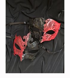 This couples Masquerade mask is made of a lightweight metal and hand painted red and black.  This unique set of masks is great for Masquerade ball, Venetian mask parties, Madi Gras, and much more.  Mask come with silk ribbon ties attached. Masks do have some flex.  Women's mask size  6"h x 5"W. Men's mask size 4"H x 6.5"W Full Face Masquerade Mask, Elegant Mask, Madi Gras, Couples Masquerade Masks, Black Masquerade Mask, Mens Masquerade Mask, Masquerade Ball Mask, Metal Mask, Female Mask