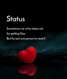 a red heart sitting on top of a table next to a black background with the words status