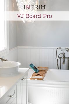 a bathroom with a tub, sink and chandelier in the background text overlay reads how to install trim for a vj board pro