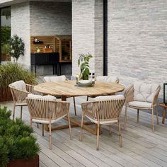 a wooden table sitting on top of a wooden deck