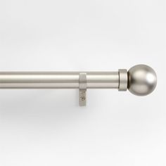 an image of a curtain rod with a ball on it's end and a metal handle