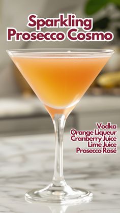 an orange cocktail in a martini glass with the words sparkling prosecco cosmoo