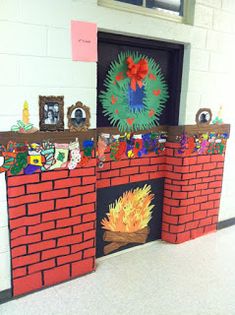 a decorated fire place in the middle of a school hallway with decorations on top and around it