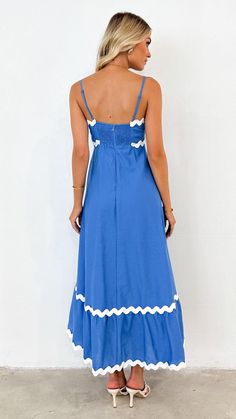 Embrace elegance with our ric rac maxi dress, featuring delicate ric rac trim and slender, adjustable straps for a perfect fit. An invisible back zip ensures a seamless look, complemented by a shirred back panel for added comfort. Fitted Maxi Dress With Ruffled Straps For Beach, Fitted Maxi Dress With Adjustable Straps For The Beach, Lined Spaghetti Strap Midi Dress For Beach, Blue Maxi Dress With Ruffled Straps For Vacation, Vacation Midi Dress With Spaghetti Straps And Lining, Beach Dresses With Lined Ruffled Straps, Sundress Style Maxi Dress With Lace Trim, Beach Dresses With Ruffled Straps And Lining, Chic Maxi Dress With Smocked Back And Spaghetti Straps